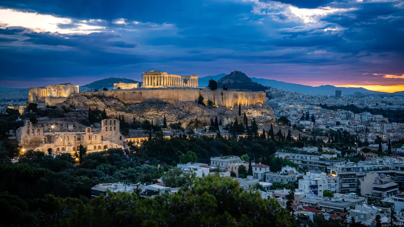 The illuminated Acropolis above Athens at daybreak