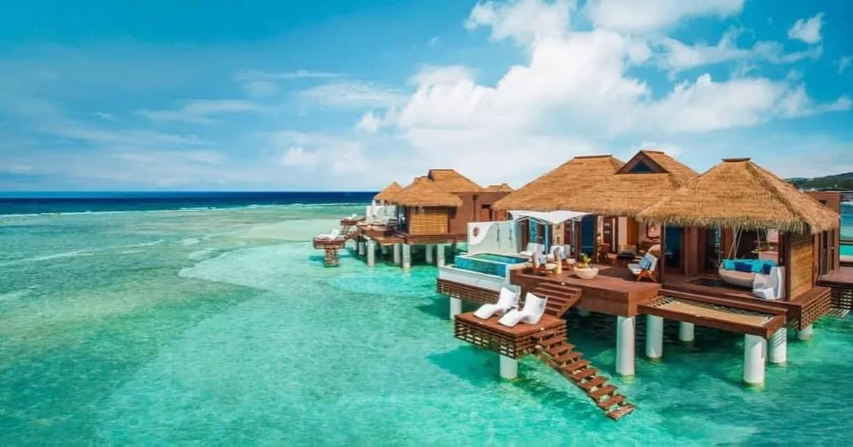 Overwater villas above clear turquoise water