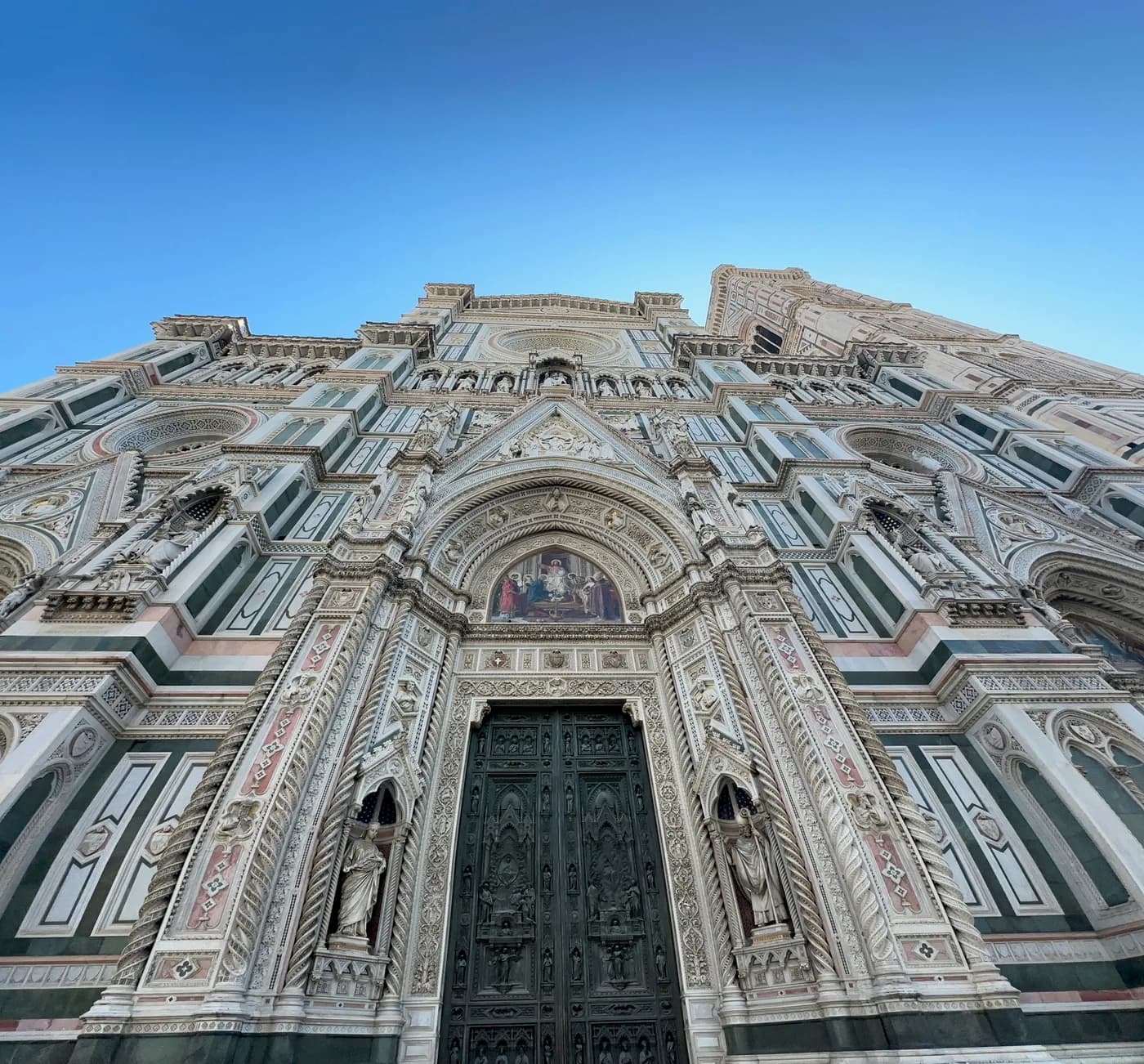 Florence Cathedral facade beneath a clear blue sky
